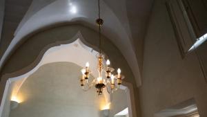 a chandelier hanging from a ceiling in a room at Palazzo Zacà in Gallipoli