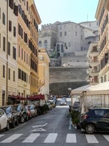 a city street with cars parked on the street at Magnoliahome Suites at the Vatican in Rome