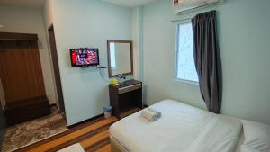 Rúm í herbergi á Sky View Hotel Dengkil Putrajaya Cyberjaya