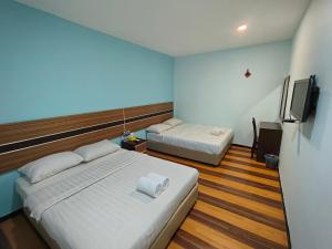 Rúm í herbergi á Sky View Hotel Dengkil Putrajaya Cyberjaya