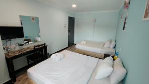 Rúm í herbergi á Sky View Hotel Dengkil Putrajaya Cyberjaya