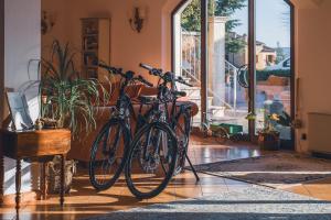 two bikes parked next to each other in a room at Arca Hotel in Pienza