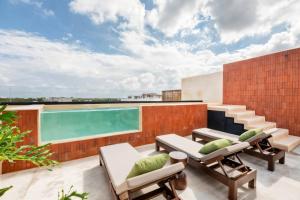 a swimming pool on the roof of a building at Xaana Private Pool 2 bed wifi 300 Mbps Rooftop in Tulum