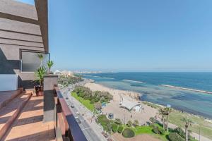a view of the beach from the balcony of a building at Loft Corso Trieste Terrazza sul Mare in Bari