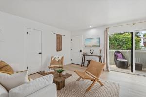 a living room with a couch and chairs at Seaside and Newly Renovated in Summerland
