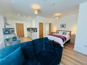 a hotel room with a bed and a couch at Viewforth Studio No.4 in Fort William