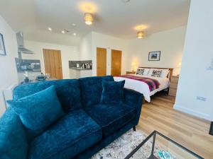 a living room with a couch and a bed at Viewforth Studio No.4 in Fort William