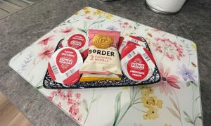 a table topped with two packages of barneys and a wrapper at Viewforth Studio No.4 in Fort William