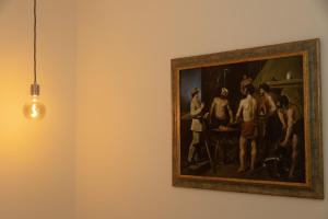 a painting of a group of men on a wall at Chez Nunù in Ercolano