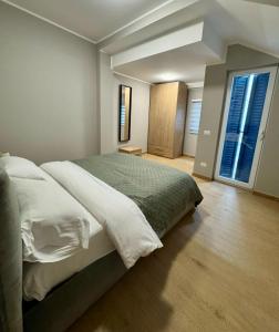 Ένα ή περισσότερα κρεβάτια σε δωμάτιο στο Casa Magenta Apartment 5 +25 φωτογραφίες