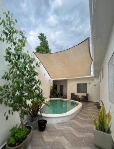 a courtyard with a swimming pool in a building at El Rinconcito in Valladolid