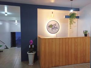 a restaurant with a counter with a flower pot at NORTE HOTEL Guaraciaba in Guaraciaba do Norte
