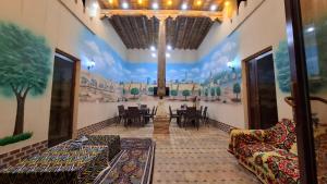 a room with a painting on the wall at Khiva Khan in Khiva