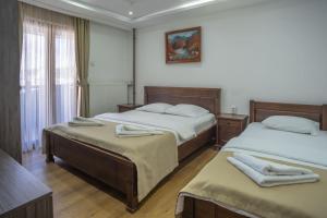 Postelja oz. postelje v sobi nastanitve Hotel Pavlović