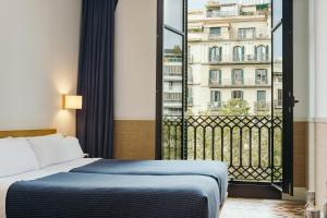 Posteľ alebo postele v izbe v ubytovaní Hotel Casa Bonay & Spa + 37 fotografií