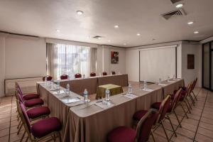 a meeting room with a long table and chairs at Royal Villas Resort in Mazatlán +71 photos