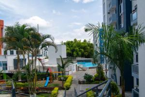 a resort with a playground and a swimming pool at EXCELENTE CONJUNTO, UBICACION PRIVILEGIADA, Torre 3 in Armenia