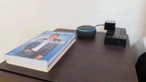 a book sitting on top of a table next to a modem at Comfortable and Centrally Located Accommodation 2 in Altamira