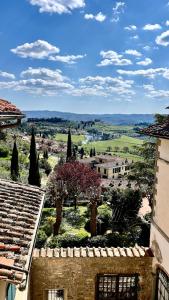 a view of a town with trees and buildings at Loft in Panzano in Panzano +9 photos