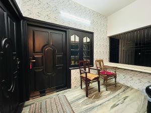 Fotografie z fotogalerie ubytování Bluebell Home v destinaci Kóžikkót