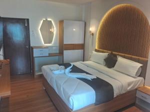 Postel nebo postele na pokoji v ubytování Hotel chela