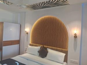 Postel nebo postele na pokoji v ubytování Hotel chela