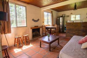 a living room with a couch and a table at Casa Dibar in La Pedrera