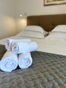 Postel nebo postele na pokoji v ubytování Hotel Vila Tina