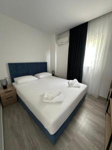 Postel nebo postele na pokoji v ubytování IO's Apartments