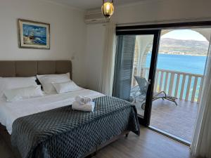 Postel nebo postele na pokoji v ubytování Hotel Vila Tina + 37 fotografií