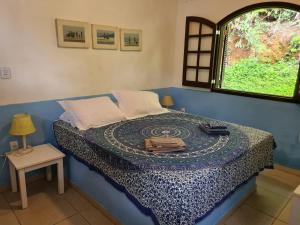 Ένα ή περισσότερα κρεβάτια σε δωμάτιο στο Linda e espetacular Casa Frente ao Mar-Praia da Aripeba-Ilha Grande