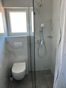 Koupelna v ubytování Hotel Vila Tina