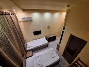 a view of a bathroom with a mirror and a sink at Li-Yes Qanaqer in Yerevan