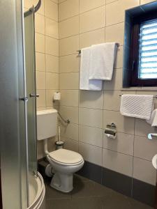 Koupelna v ubytování Hotel Vila Tina