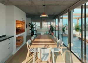 a dining room with a table and chairs at Sudestada Apartamentos Turisticos in Punta del Este