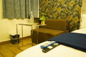 Voodi või voodid majutusasutuse Hotel AlpineglO Yercaud toas