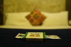 Voodi või voodid majutusasutuse Hotel AlpineglO Yercaud toas