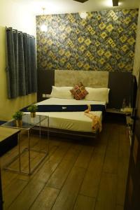 Voodi või voodid majutusasutuse Hotel AlpineglO Yercaud toas