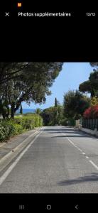 an empty road with trees on the side of the road at Sainte-Maxime appartement 45m avec jardin de 50m in Sainte-Maxime