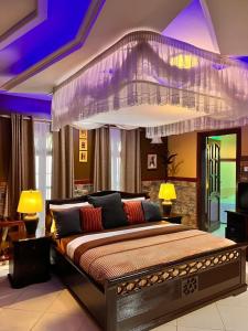 a bedroom with a large bed in a room at Meru Havens in Arusha