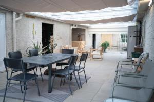 a table and chairs sitting on a patio at Casa Milladoiro in Miño