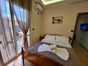 Postel nebo postele na pokoji v ubytování L&G Hotel