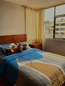 Postel nebo postele na pokoji v ubytování Cómodo apartamento con aire puro y vista panorámica ideal para turistas + 8 fotografií