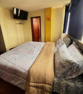 Postel nebo postele na pokoji v ubytování Cómodo apartamento con aire puro y vista panorámica ideal para turistas
