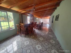 a dining room with a table and chairs in it at La posada del iguazu in Puerto Iguazú