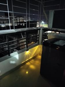 a view of a balcony at night at Shikha's-Urban Rest in Guwahati