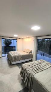 Ένα ή περισσότερα κρεβάτια σε δωμάτιο στο Casa em Barreirinhas Lençóis Maranhenses