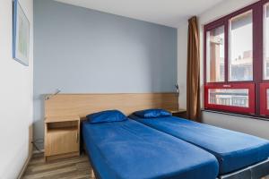 Postel nebo postele na pokoji v ubytování Appartement at lake Veluwemeer, nearby Harderwijk, 63km from Amsterdam