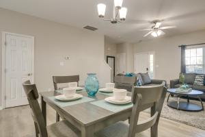a dining room and living room with a table and chairs at Pets Welcome Townhome with Patio in Raleigh! in Raleigh