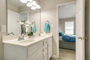 a bathroom with a sink and a mirror at Pets Welcome Townhome with Patio in Raleigh! in Raleigh +24 photos